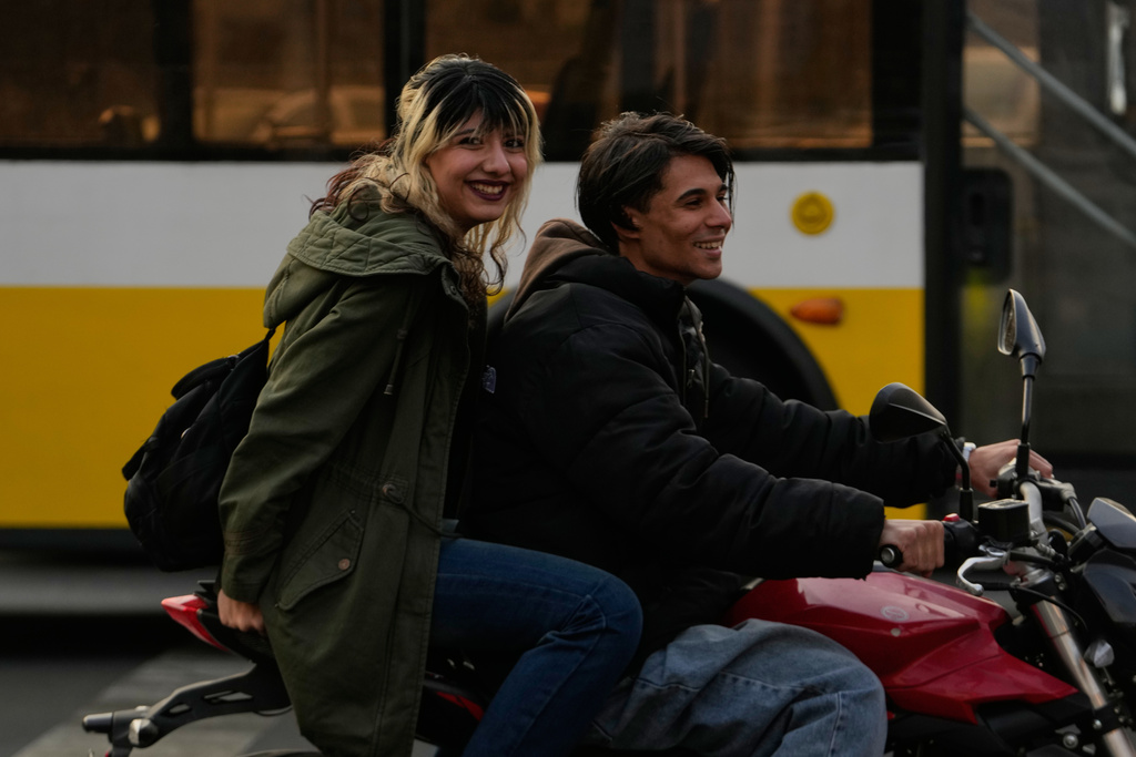 A man and a woman ride a motorbike in northern Tehran, Iran, Thursday, Nov. 20, 2025. (AP Photo/Vahid Salemi)
