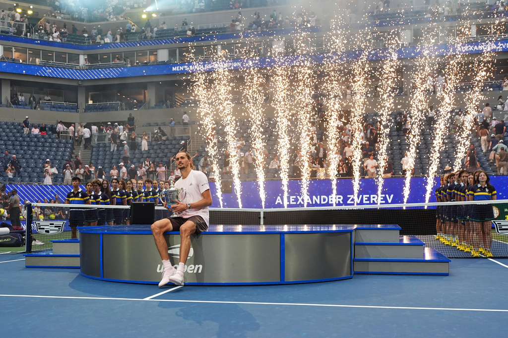 Alexander Zverev, of Germany, holds his trophy after winning the men's singles final of the U.S. Open tennis championships against Ben Shelton, of the United States, Sunday, Sept. 13, 2026, in New York. (AP Photo/Frank Franklin II)