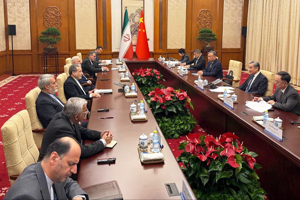 In this photo released by the Telegram channel of Iranian Foreign Minister Abbas Araghchi, China's Foreign Minister Wang Yi, second from right, meets with Iran's Foreign Minister Abbas Araghchi, center left, and their delegations in Beijing, China, Wednesday, May 6, 2026. (Telegram channel of the Iranian Foreign Minister via AP)