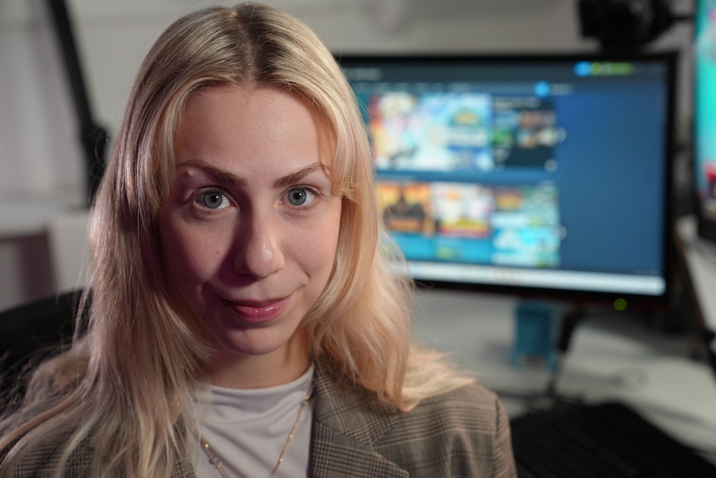 Danish video game live-streamer Marie Watson, 28, poses for a photo in her studio in Taastrup, Denmark, Thursday, Oct. 9, 2025. (AP Photo/James Brooks)