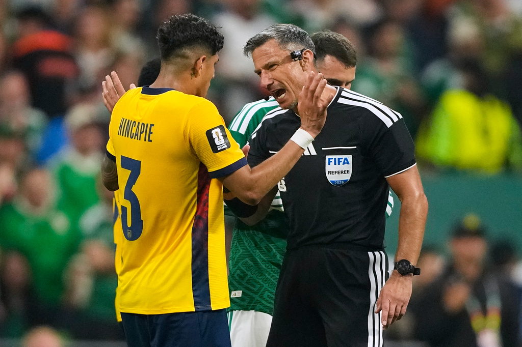 Referee Slavko Vincic of Slovenia speaks to Ecuador's Piero Hincapie (3) before sending him from the field during the World Cup round of 32 soccer match between Mexico and Ecuador in Mexico City, Tuesday, June 30, 2026. (AP Photo/Natacha Pisarenko)