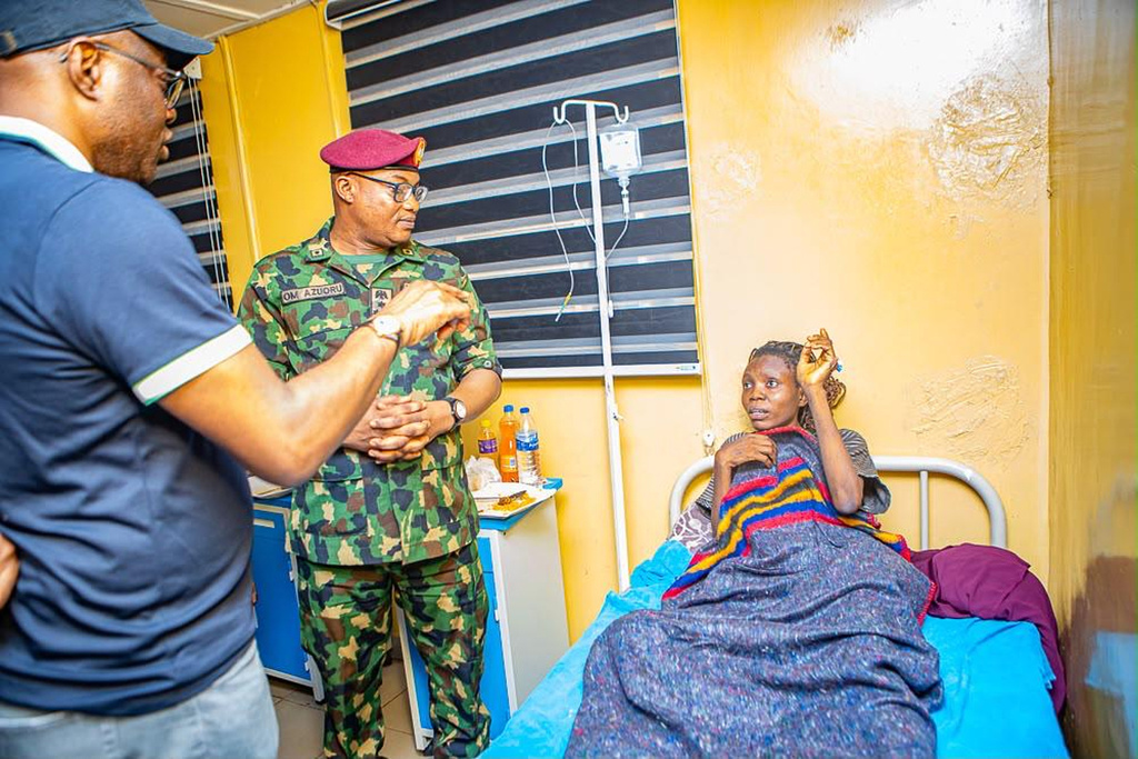 In this photo released by Oyo state government House, Governor Seyi Makinde, left, visits a teacher abducted in May by Islamic militants, following her release at a hospital in southwestern Oyo, Nigeria, Saturday, July 11, 2026. (Oyo State government House via AP)