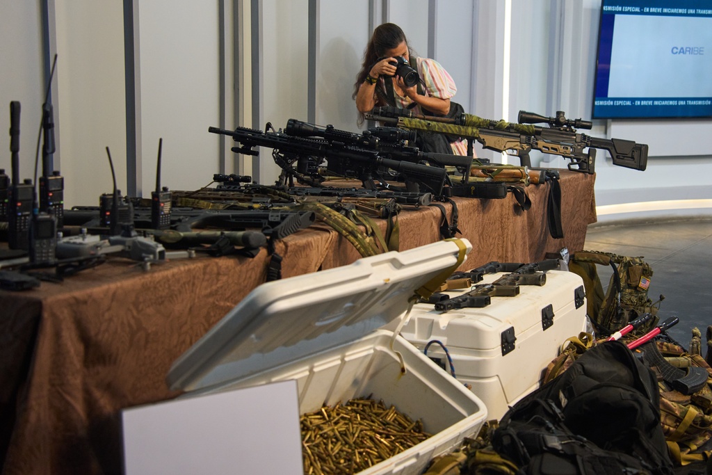 Weapons that Cuban authorities say were recovered from a speedboat in Cuban waters following a confrontation that left four people dead are displayed during a media presentation in Havana, Friday, Feb. 27, 2026. (AP Photo/Ramon Espinosa)