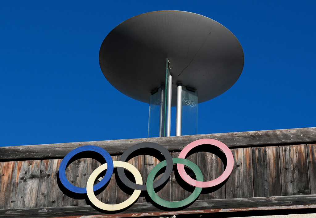 FILE - The Olympic rings adorn the Stadio Olimpico del Ghiaccio, which will be called Cortina Curling Olympic Stadium, venue for the curling discipline at the Milan Cortina 2026 Winter Olympics, in Cortina d'Ampezzo, Italy, Thursday, Jan. 16, 2025. (AP Photo/Giovanni Auletta, File)
