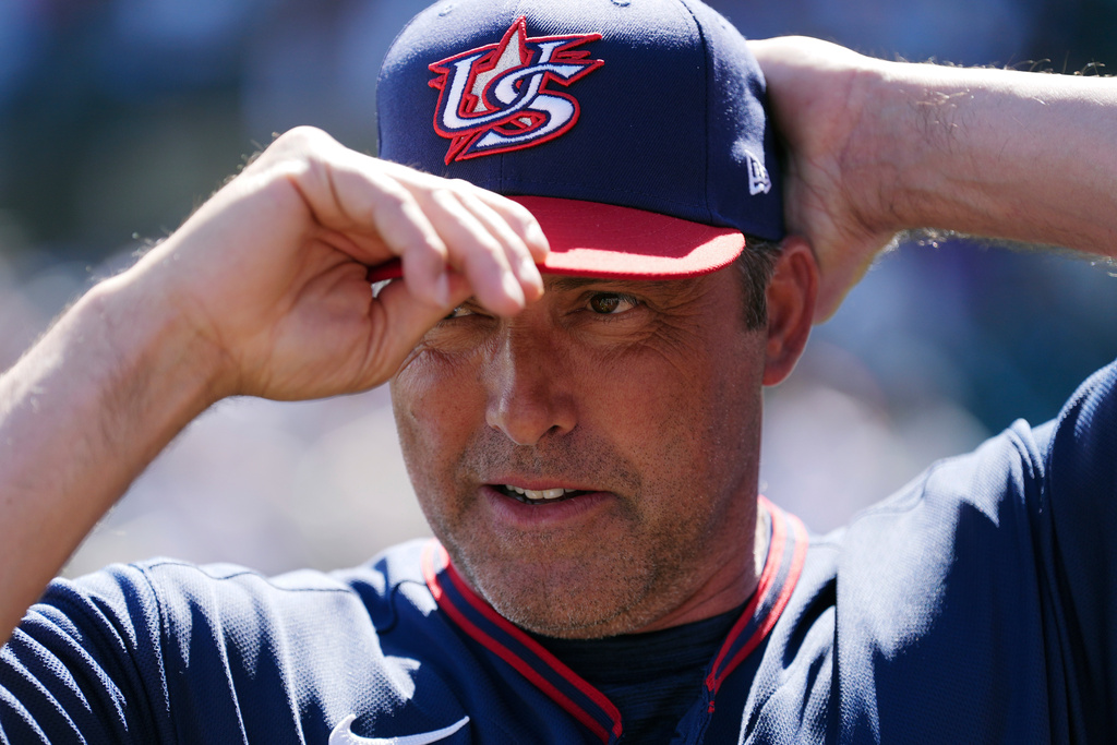 United States manager Mark DeRosa adjusts his baseball cap prior to an exhibition baseball game against the Colorado Rockies Wednesday, March 4, 2026, in Scottsdale, Ariz. (AP Photo/Ross D. Franklin)