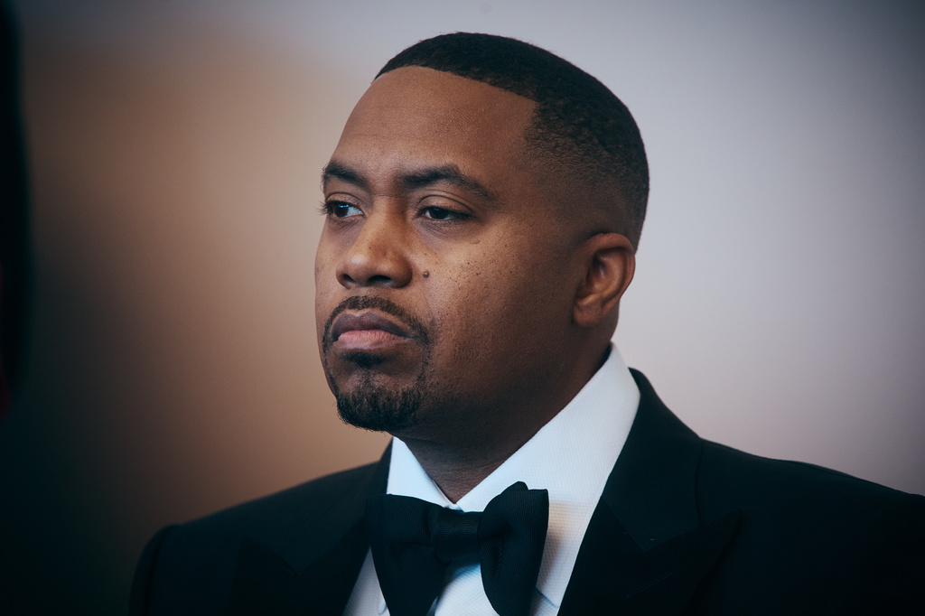 FILE - Rapper Nas listens to a speaker during the opening of live table games at Resorts World New York City on April 28, 2026, in New York. (AP Photo/Andres Kudacki, File)