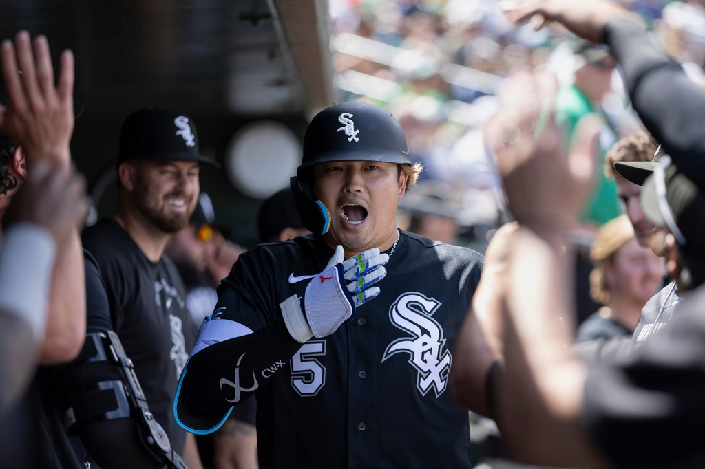 Chicago White Sox's Munetaka Murakami, center, celebrates after hitting a two-run home run during the fifth inning of a baseball game against the Athletics, Sunday, April 19, 2026, in West Sacramento, Calif. (AP Photo/Sara Nevis)