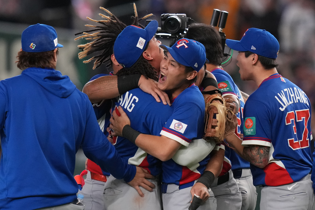 Taiwan players celebrate after defeating South Korea during a World Baseball Classic game between South Korea and Taiwan on Sunday, March 8, 2026 in Tokyo, Japan. (AP Photo/Eugene Hoshiko)