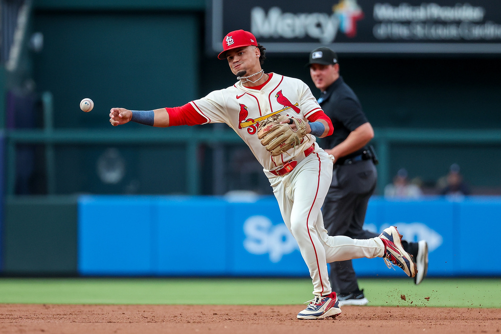 St. Louis Cardinals' Masyn Winn throws to first base for an out against Atlanta Braves' Michael Harris II during the third inning of a baseball game Saturday, July 11, 2026, in St. Louis. (AP Photo/Scott Kane)