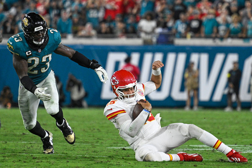 Kansas City Chiefs quarterback Patrick Mahomes slides past Jacksonville Jaguars linebacker Foyesade Oluokun (23) for a first down during the second half of an NFL football game against the Jacksonville Jaguars, Monday, Oct. 6, 2025, in Jacksonville, Fla. (AP Photo/Phelan M. Ebenhack) Kansas City Chiefs quarterback Patrick Mahomes slides past Jacksonville Jaguars linebacker Foyesade Oluokun (23) for a first down during the second half of an NFL football game against the Jacksonville Jaguars, Monday, Oct. 6, 2025, in Jacksonville, Fla. (AP Photo/Phelan M. Ebenhack)