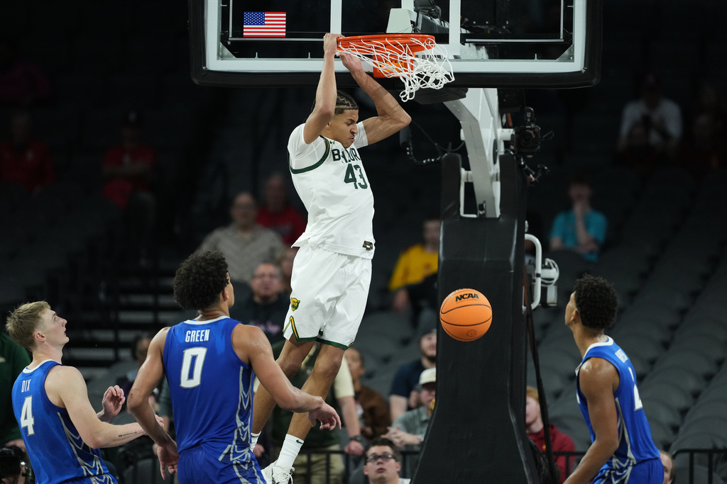 Baylor guard Cameron Carr (43) scores against the Creighton during the second half of an NCAA college basketball game in Las Vegas, Monday, Nov. 24, 2025. (AP Photo/Eric Gay)