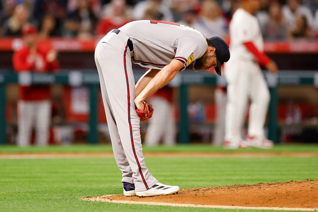 Atlanta Braves starter Chris Sale reacts after hitting Los Angeles Angels designated hitter Yoan Moncada with a pitch during the fourth inning of a baseball game Monday, April 6, 2026, in Anaheim, Calif. (AP Photo/Caroline Brehman)