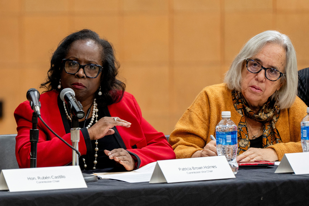 Illinois Accountability Commission Vice Chair Patricia Brown Holmes, left, speaks during the commission's first hearing at Arturo Velasquez Institute at Richard J. Daley College in the Lower West Side of Chicago, Thursday, Dec. 18, 2025. (Chicago Sun-Times via AP)