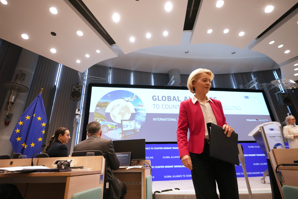 European Commission President Ursula von der Leyen steps off the podium after addressing a Conference of the Global Alliance to Counter Migrant Smuggling at the EU Charlemagne building in Brussels, Wednesday, Dec. 10, 2025. (AP Photo/Virginia Mayo)