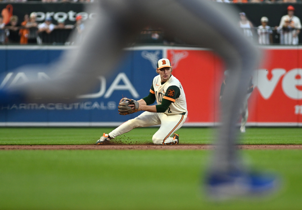 Baltimore Orioles shortstop Gunnar Henderson fields a grounder before turning a double play on a ball hit by Kansas City Royals' Nick Loftin, not pictured, during the second inning of a baseball game, Friday, July 10, 2026, in Baltimore. (AP Photo/Steve Ruark)