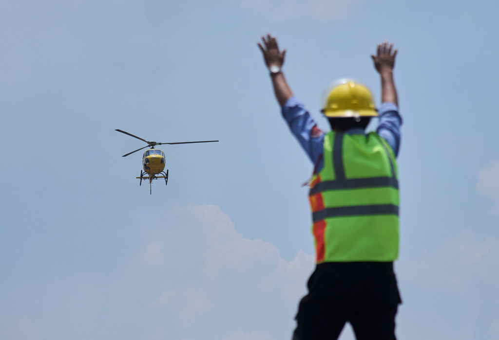 A helicopter carrying Dawa Sherpa, a mountain guide who had been missing for several days in the Everest region, arrives at HAMS Hospital in Kathmandu, Nepal, Thursday, June 4, 2026. (AP Photo/Niranjan Shrestha) CORRECTION: Corrects hospital name to HAMS not Grande