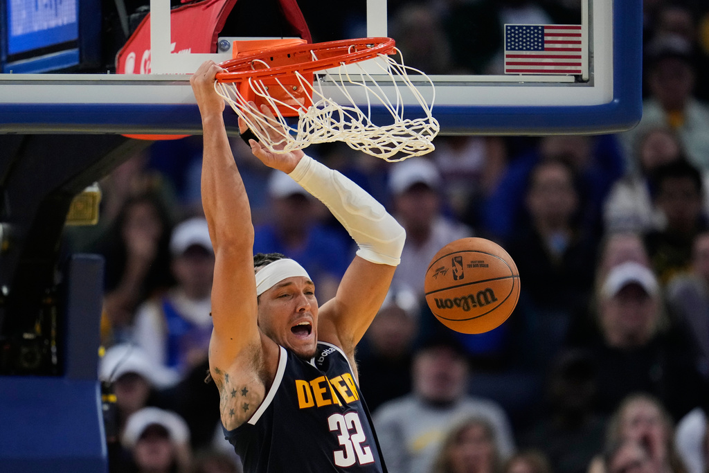 Denver Nuggets forward Aaron Gordon dunks during the second half of an NBA basketball game against the Golden State Warriors, Thursday, Oct. 23, 2025, in San Francisco. (AP Photo/Godofredo A. Vásquez)