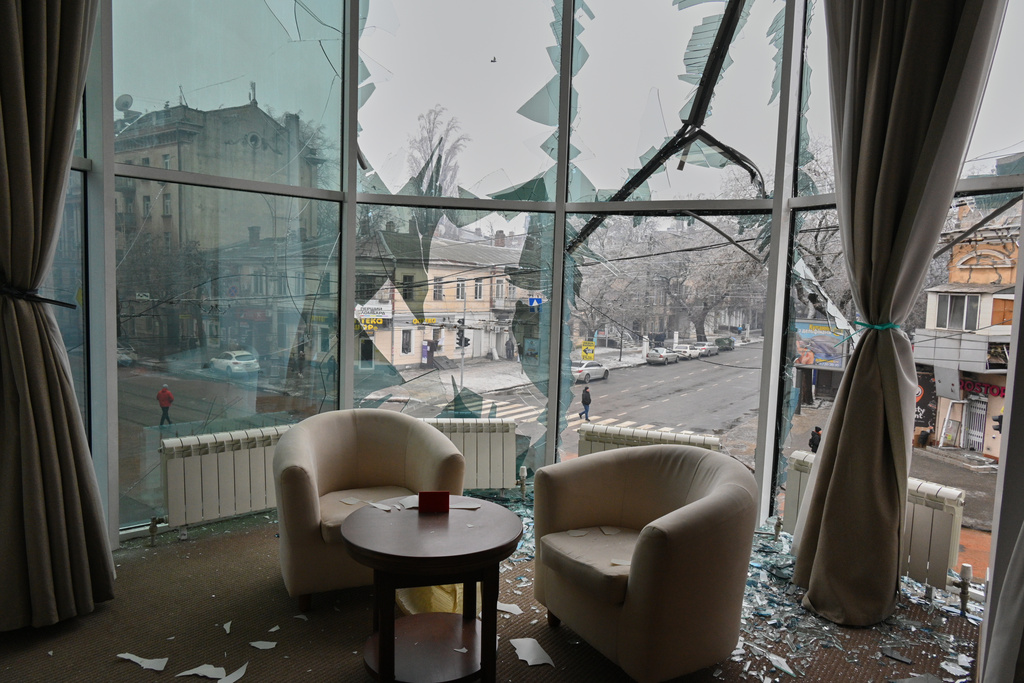 Broken window glass is seen in an apartment following a Russian air attack in the city center in Odesa, Ukraine, Tuesday, Jan. 27, 2026. (AP Photo/Michael Shtekel)