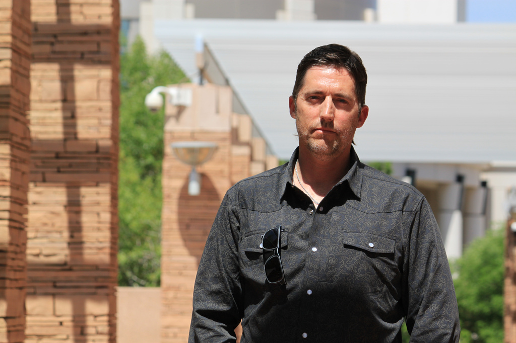 DEA Special Agent David Howell, who filed a whistleblower complaint, poses for a portrait outside the U.S. district courthouse in Albuquerque, N.M., on Friday, June 12, 2026. (AP Photo/Susan Montoya Bryan)