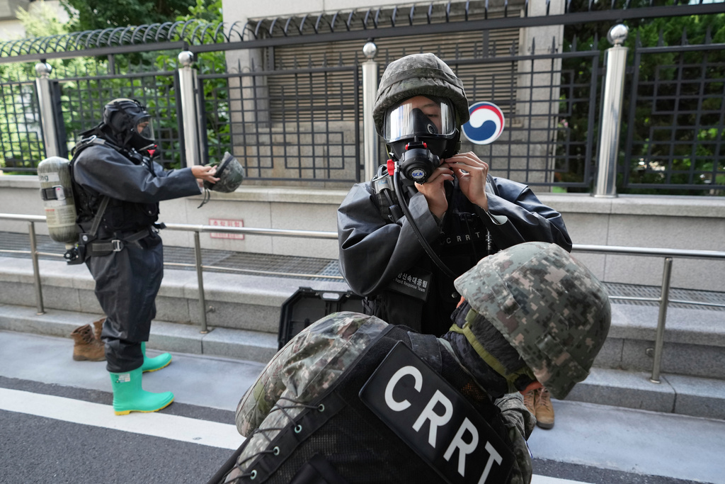 Members of Chemical, Biological, Radiological, and Nuclear Rapid Response Team from South Korean soldiers check up their gears upon their arrival for an anti-terror drill as a part of the annual Ulchi exercise at the government building in Seoul, South Korea, Tuesday, Aug. 19, 2025. (AP Photo/Lee Jin-man)
