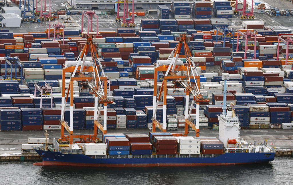 Containers are stacked at a port in Yokohama, near Tokyo on Aug. 1, 2025. (Takuto Kaneko/Kyodo News via AP)