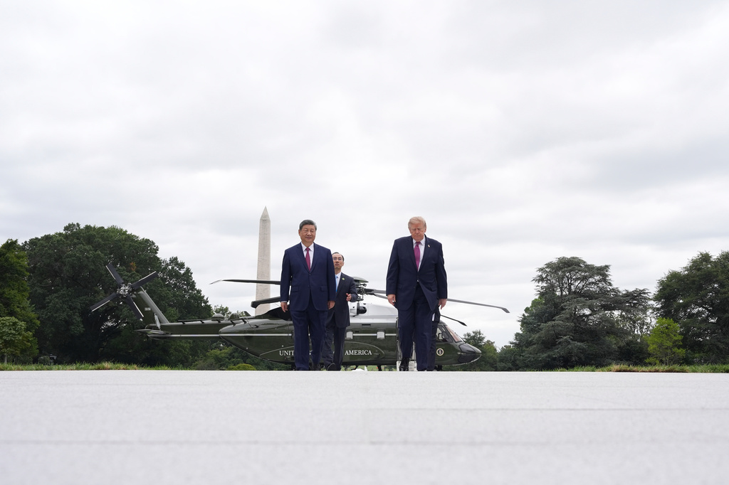 President Donald Trump, right, and China's President Xi Jinping walk on the new helipad after boarding Marine One during a tour of the South Lawn of the White House, Thursday, Sept. 24, 2026, in Washington. (AP Photo/Alex Brandon)