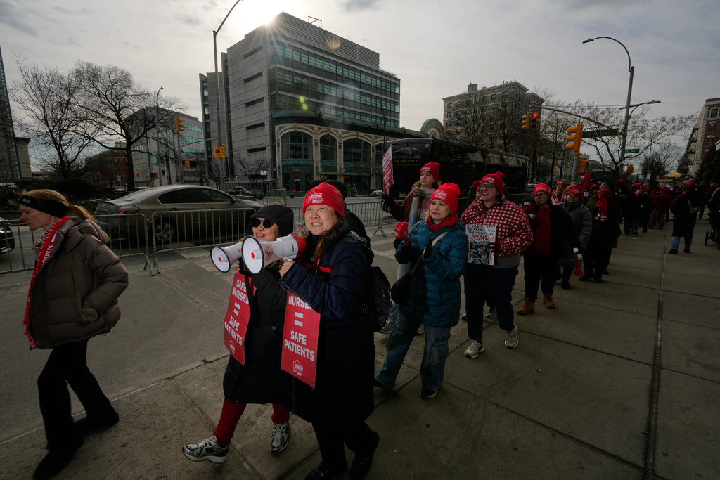 Striking nurses and supporters demonstrate outside NewYork-Presbyterian Hospital in New York, Thursday, Jan. 22, 2026. (AP Photo/Seth Wenig)