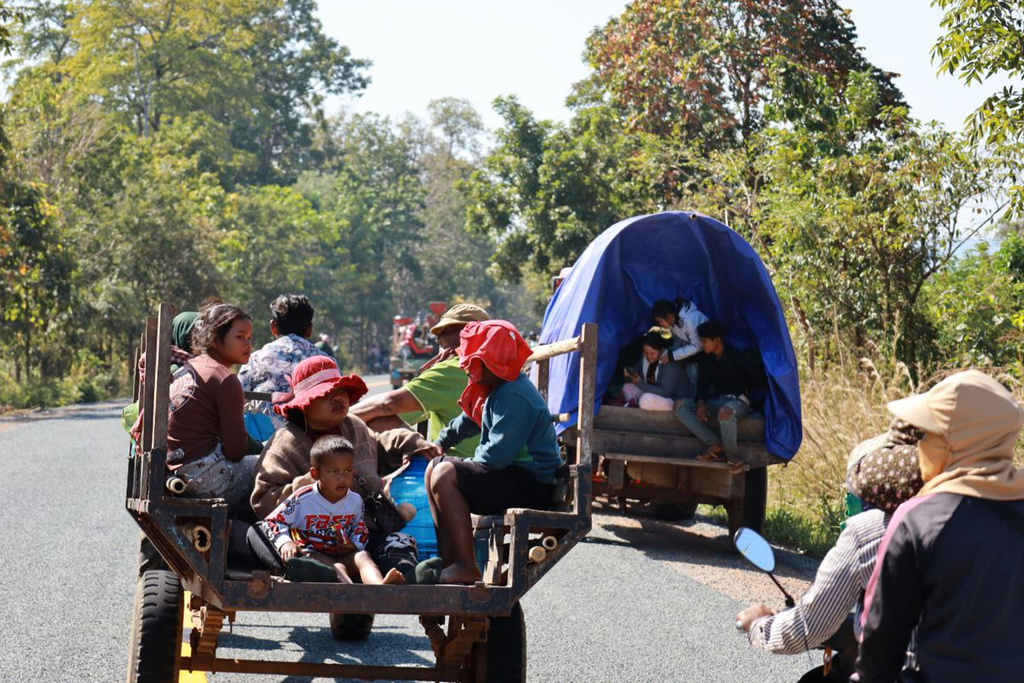 In this photo released by Agence Kampuchea Press (AKP), Cambodian villagers, transported by motor cart and tractor, flee from their home in Preah Vihear province, Cambodia, Monday, Dec. 8, 2025. (AKP via AP)