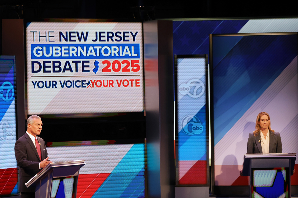 Republican Jack Ciattarelli, left, and Democrat Mikie Sherrill participate in the final debate in the New Jersey governor's race, Wednesday, Oct. 8, 2025, in New Brunswick, N.J. (AP Photo/Heather Khalifa)