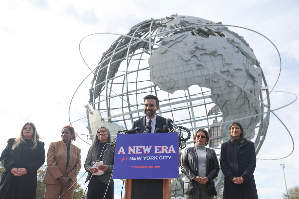 New York City mayor-elect Zohran Mamdani, center, speaks in front of the Unisphere alongside his transition team, from left, Elana Leopold, Melanie Hartzog, Maria Torres-Springer, Grace Bonilla, and Lina Khan, in the Queens borough of New York, Wednesday, Nov. 5, 2025. (AP Photo/Heather Khalifa)