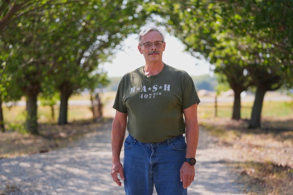 Ed Westrick, 59, poses for a photo at his home's driveway near Commerce, Texas, Friday, Sept. 18, 2026. (AP Photo/LM Otero)