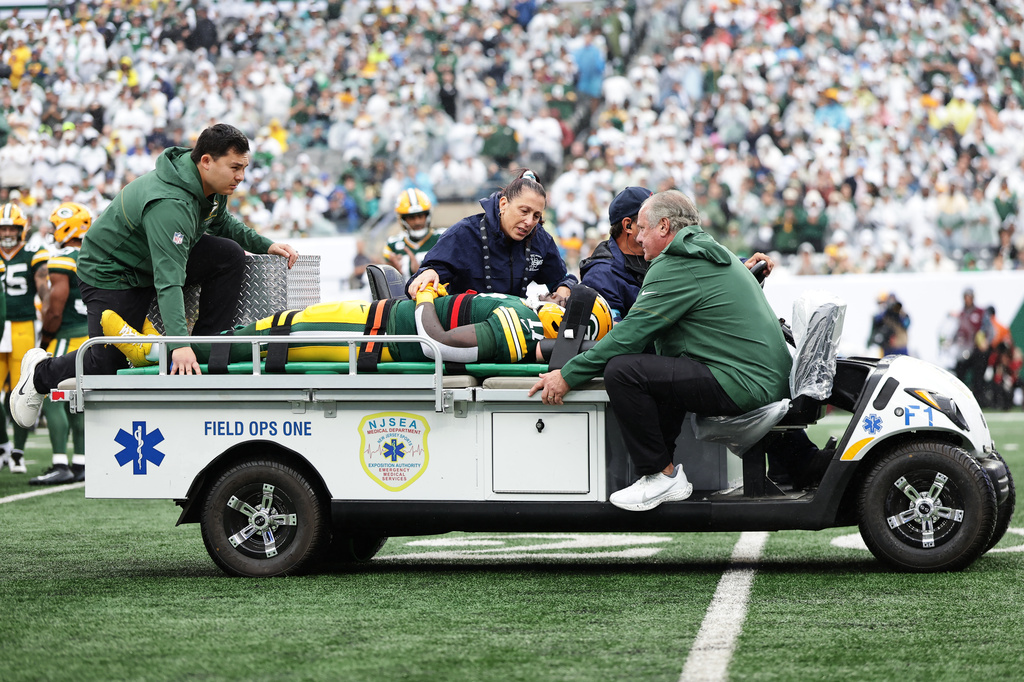 Green Bay Packers wide receiver Jayden Reed (11) is taken off the field following an injury during an NFL football game againt the New York Jets in East Rutherford, N.J., Sunday, Sept. 20, 2026. (AP Photo/Adam Hunger)