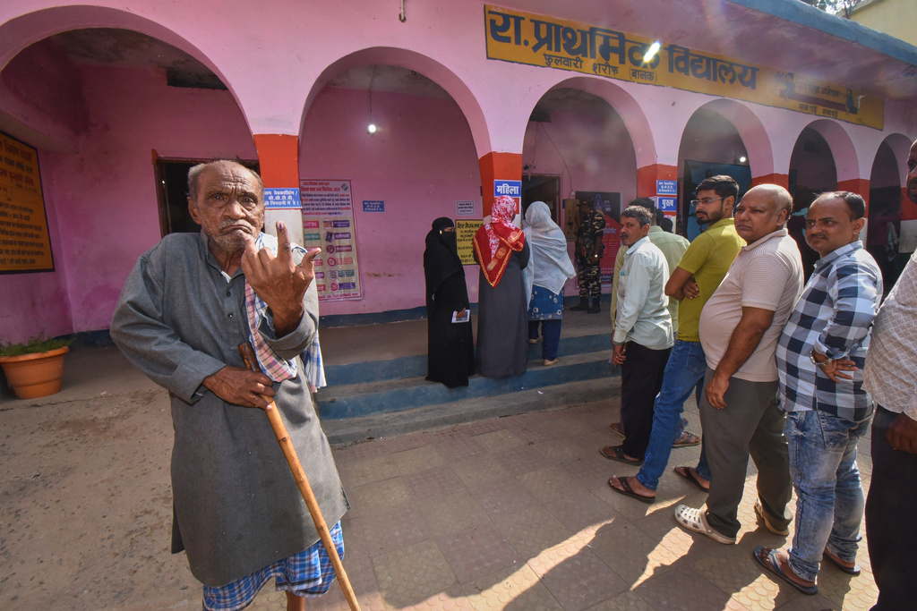 An elderly person shows his indelible ink mark on his finger after casting vote during Bihar state election at a polling booth in Patna, India, Thursday, Nov. 6, 2025. (AP Photo)