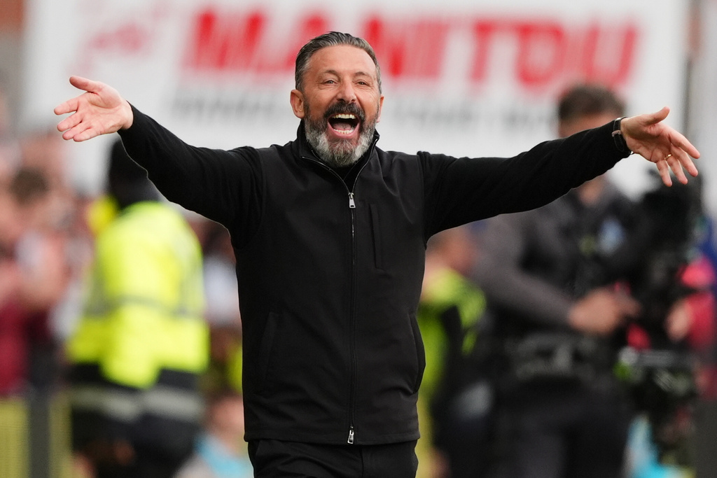 Heart of Midlothian manager Derek McInnes celebrates after the William Hill Premiership soccer match at Tynecastle Park, Edinburgh, Monday, May 4, 2026. (Andrew Milligan/PA via AP)