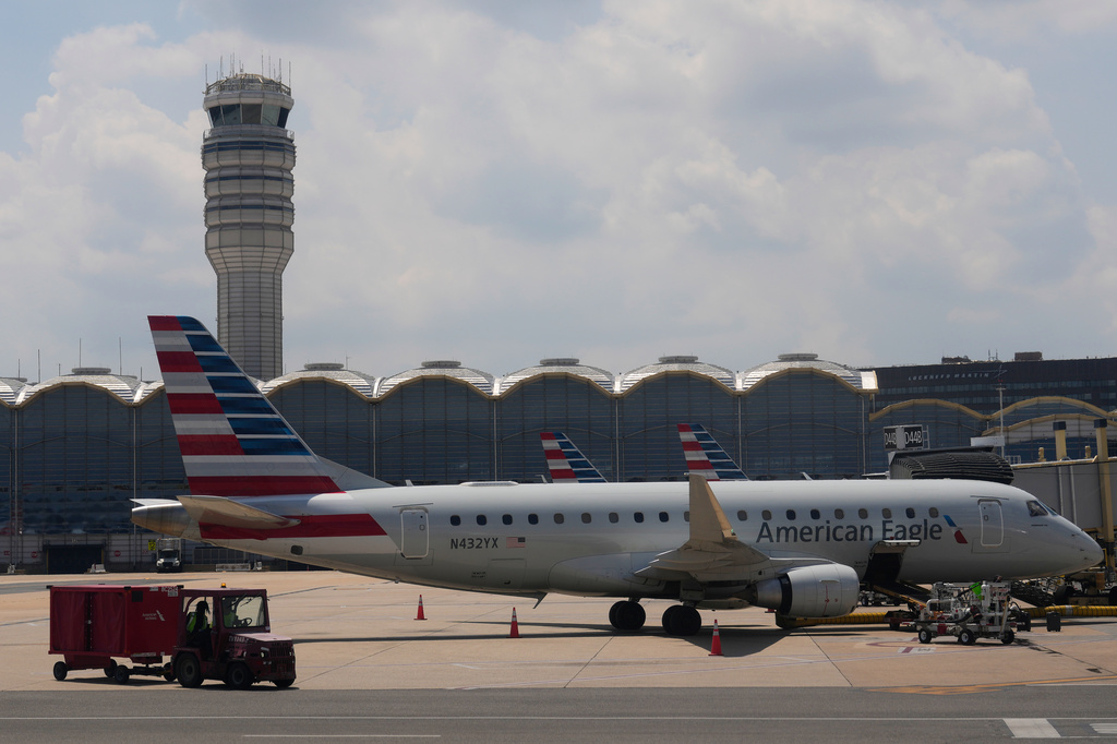 FILE - An American Eagle plane is parked at a gate at the Ronald Reagan Washington National Airport in Arlington, Va., June 29, 2026. (AP Photo/Carolyn Kaster, File)