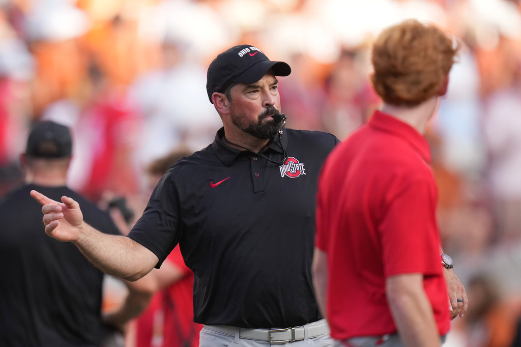 Ohio State head coach Ryan Day watches players warm up before an NCAA college football game against Texas in Austin, Texas, Saturday, Sept. 12, 2026. (AP Photo/Eric Gay)