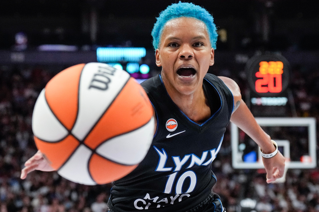 Minnesota Lynx guard Courtney Williams (10) reaches for a loose ball during first half of a WNBA basketball game in Toronto on Thursday, July 30, 2026. (Chris Young/The Canadian Press via AP)