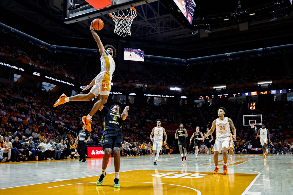 Tennessee guard Ja'Kobi Gillespie (0) dunks over Northern Kentucky guard Dan Gherezgher (0) during the first half of an NCAA college basketball game Saturday, Nov. 8, 2025, in Knoxville, Tenn. (AP Photo/Wade Payne)