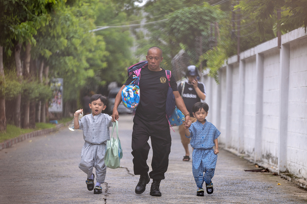 Children are evacuated from around the Debsirin Nonthaburi School, where a shooting killed several people in Thailand's Nonthaburi province, Friday, Aug. 7, 2026. (AP Photo/Wason Wanichakorn)