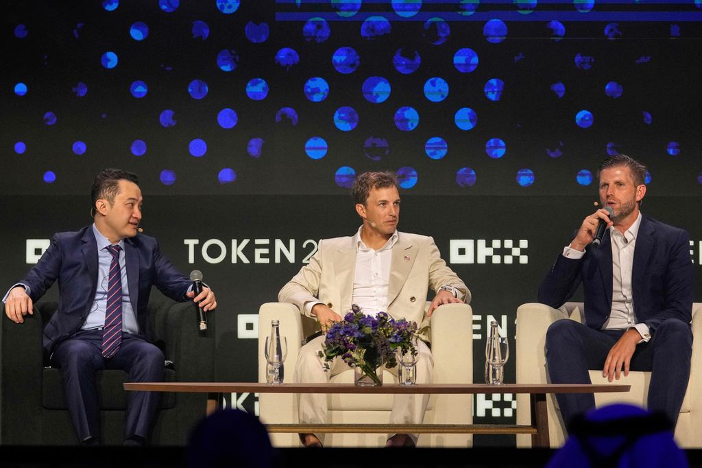 FILE - Eric Trump, Executive vice president of The Trump Organization, from right, speaks as co-founder of World Liberty Financial Zach Witkoff and founder of TRON Justin Sun look on during Token 2049, a Crypto event, in Dubai, United Arab Emirates, May 1, 2025. (AP Photo/Altaf Qadri, File)