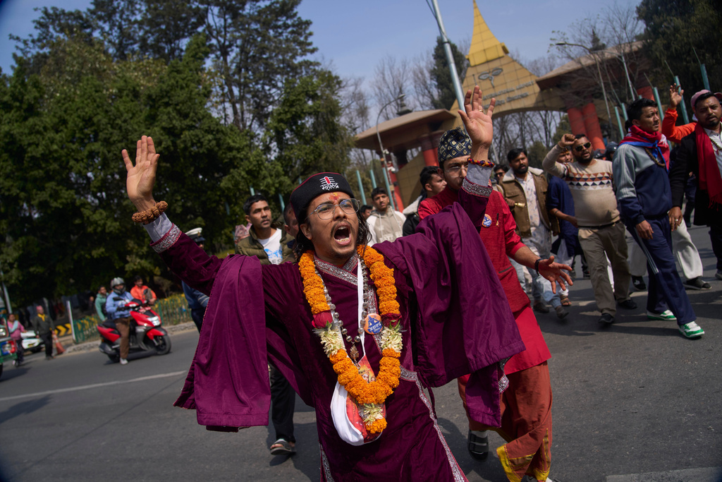 Supporters gather to welcome Nepal's former King Gyanendra Shah upon his arrival at Tribhuvan International Airport in Kathmandu, Nepal, Friday, Feb. 13, 2026. (AP Photo/Niranjan Shrestha)