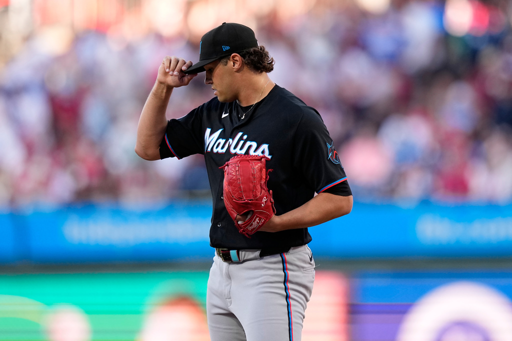 Miami Marlins pitcher Tyler Phillips adjusts his hat after giving up a two-run triple to Philadelphia Phillies' Bryson Stott during the first inning of a baseball game Tuesday, June 16, 2026, in Philadelphia. (AP Photo/Matt Slocum)