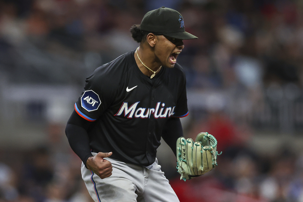 Miami Marlins pitcher Edward Cabrera reacts after completing eight innings of a baseball game against the Atlanta Braves, Friday, Aug. 8, 2025, in Atlanta. (AP Photo/Colin Hubbard)