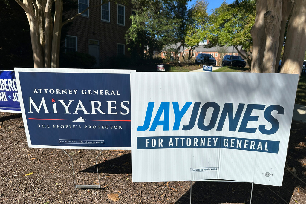 Campaign signs for Republican Virginia Attorney General Jason Miyares and Democratic challenger Jay Jones appear outside the elections office for the City of Fairfax, Va., Friday, Oct. 17, 2025. (AP Photo/Robert Yoon)