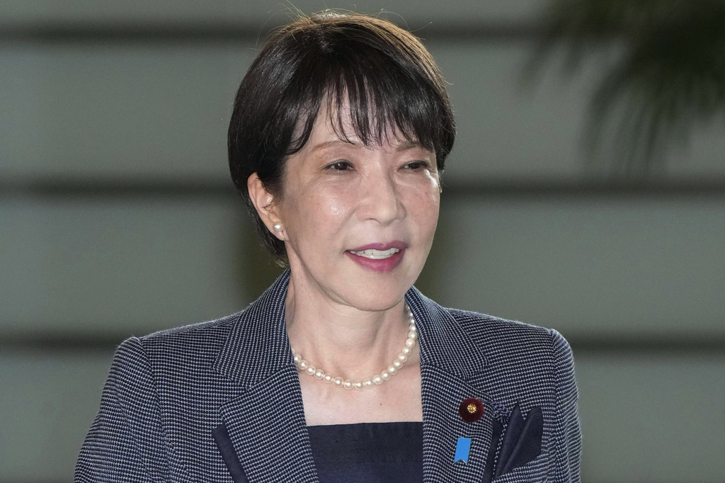 Japan's Prime Minister Sanae Takaichi enters her prime minister's office in Tokyo, Friday, Aug. 21, 2026. (Keisuke Hosojima/Kyodo News via AP)