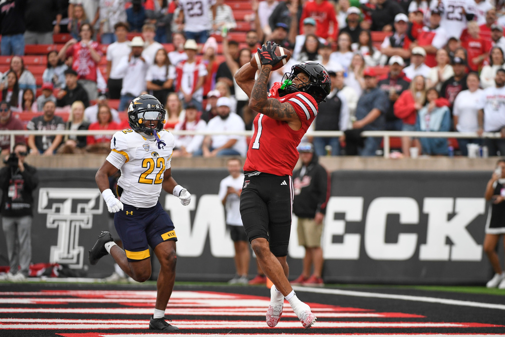 Texas Tech wide receiver Reggie Virgil (1) catches a touchdown pass against Kent State during the first half of an NCAA college football game Saturday, Sept. 6, 2025, in Lubbock, Texas. (AP Photo/Justin Rex)