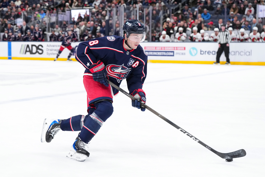 Columbus Blue Jackets defenseman Zach Werenski (8) controls the puck during the second period of an NHL hockey game against the Ottawa Senators Tuesday, Jan. 20, 2026, in Columbus, Ohio. (AP Photo/Jeff Dean)