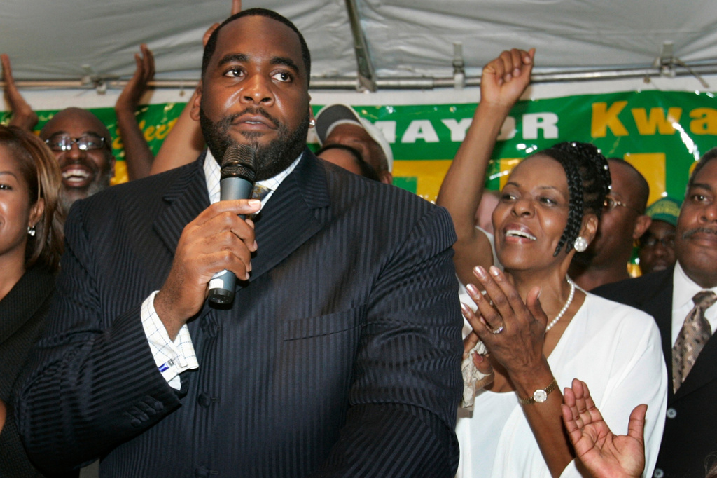 FILE - U.S. Rep. Carolyn Cheeks Kilpatrick stands behind her son, Detroit Mayor Kwame Kilpatrick, during a primary in Detroit on Aug. 2, 2005. (AP Photo/Carlos Osorio, file)