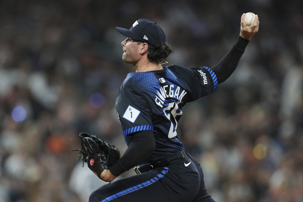 Detroit Tigers pitcher Kyle Finnegan throws against the Kansas City Royals in the seventh inning during a baseball game Friday, Aug. 22, 2025, in Detroit. (AP Photo/Paul Sancya)