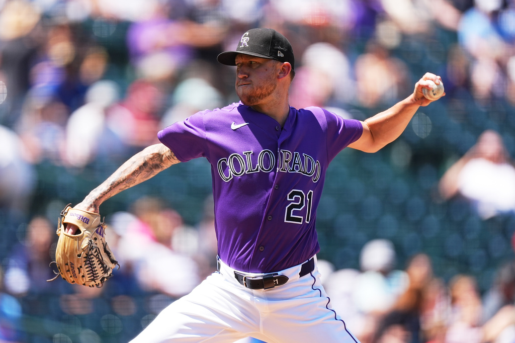 Colorado Rockies starting pitcher Kyle Freeland works against the Kansas City Royals in the first inning of a baseball game Sunday, Aug. 2, 2026, in Denver. (AP Photo/David Zalubowski)